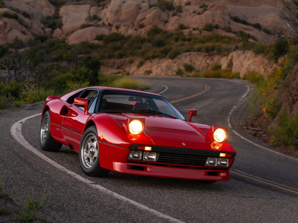 1985 Ferrari 288 GTO front three quarter winding road headlights up